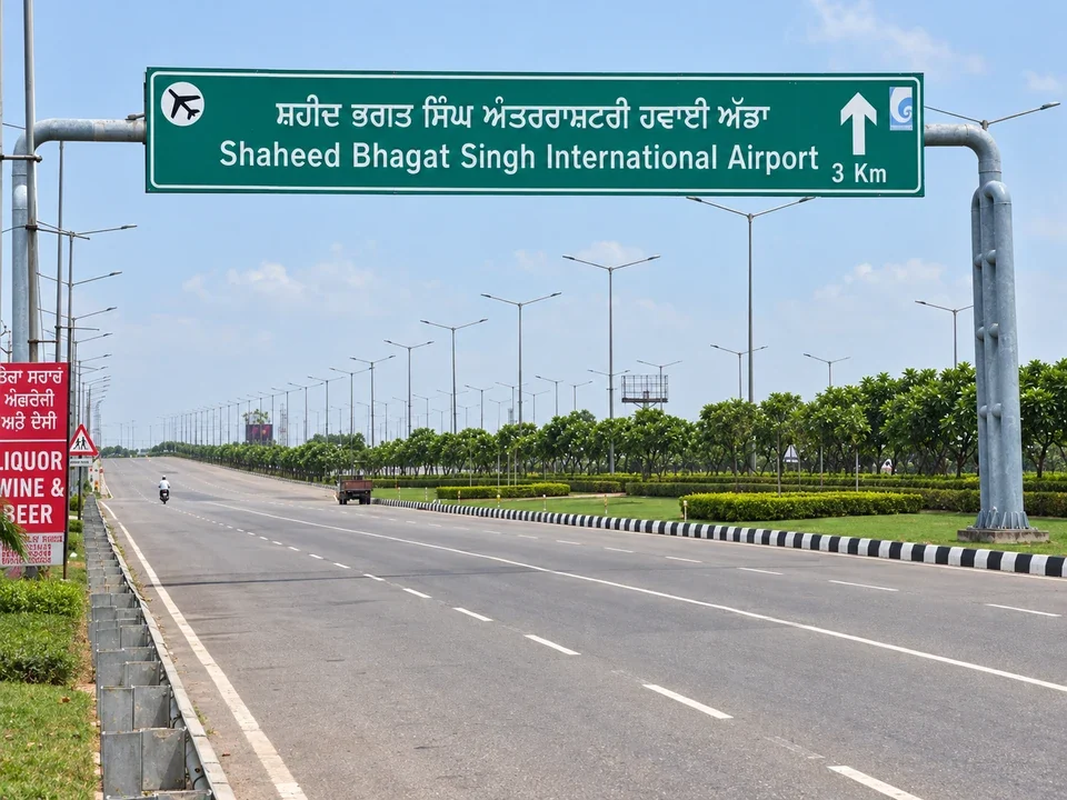 Recreated Airport Road view with the Shaheed Bhagat Singh International Airport direction sign near Noble Callista Mohali
