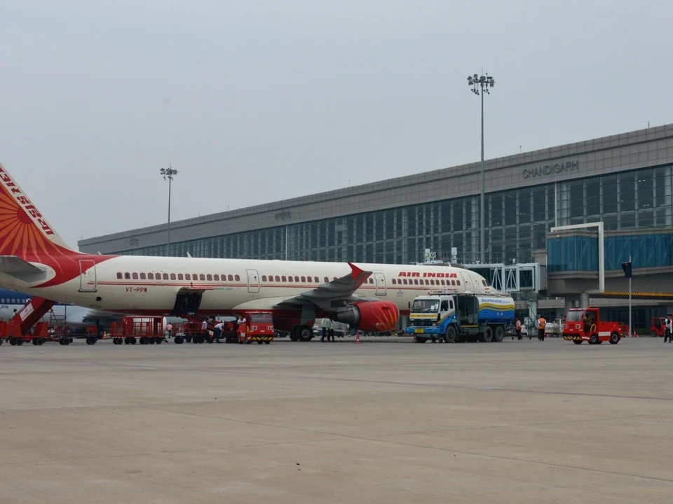 Passenger aircraft parked beside the Chandigarh Airport terminal near Noble Callista Mohali